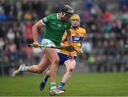 23 January 2022; Gearoid Hegarty of Limerick in action against Aaron Fitzgerald of Clare during the 2022 Co-op Superstores Munster Hurling Cup Final match between Limerick and Clare at Cusack Park in Ennis, Clare. Photo by Ray McManus/Sportsfile
