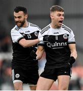 16 January 2022; Conor Laverty, left, and Jerome Johnston of Kilcoo celebrate winning a free during the AIB Ulster GAA Football Club Senior Championship Final match between Derrygonnelly Harps and Kilcoo at the Athletic Grounds in Armagh. Photo by Ramsey Cardy/Sportsfile