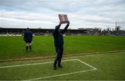 23 January 2022; The fourth official raises a board to indicate the period of aditional time to be played during the 2022 Co-op Superstores Munster Hurling Cup Final match between Limerick and Clare at Cusack Park in Ennis, Clare. Photo by Ray McManus/Sportsfile