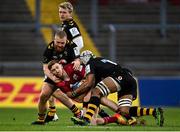 23 January 2022; Ben Healy of Munster is tackled by Wasps players Nizaam Carr, right, and Tom West of Wasps during the Heineken Champions Cup Pool B match between Munster and Wasps at Thomond Park in Limerick. Photo by Piaras Ó Mídheach/Sportsfile