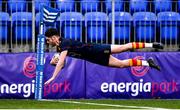 26 January 2022; Colm Condon of Temple Carrig divers over to score his side's second try during the Bank of Ireland Vinnie Murray Cup 1st Round match between Temple Carrig, Wicklow and St Andrews College, Dublin at Energia Park in Dublin. Photo by Ben McShane/Sportsfile