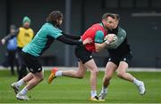 26 January 2022; Jack Carty is tackled by Mack Hansen, left, and Garry Ringrose during Ireland Rugby squad training at IRFU HPC at the Sport Ireland Campus in Dublin. Photo by Brendan Moran/Sportsfile