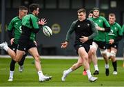 26 January 2022; Garry Ringrose, right, passes to teammate Hugo Keenan during Ireland Rugby squad training at IRFU HPC at the Sport Ireland Campus in Dublin. Photo by Brendan Moran/Sportsfile