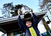 27 January 2022; Jockey Darragh O'Keeffe with the trophy after riding Longhouse Poet to win the Goffs Thyestes Handicap Steeplechase at Gowran Park in Kilkenny. Photo by Harry Murphy/Sportsfile
