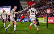 28 January 2022; Craig Gilroy, 14, celebrates with Ulster teammate Nathan Doak after scoring their side's fourth try during the United Rugby Championship match between Ulster and Scarlets at the Kingspan Stadium in Belfast. Photo by Ramsey Cardy/Sportsfile
