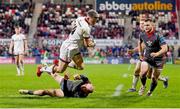 28 January 2022; Craig Gilroy of Ulster evades the tackle of Ioan Nicholas of Scarlets on his way to scoring his side's fourth try during the United Rugby Championship match between Ulster and Scarlets at the Kingspan Stadium in Belfast. Photo by Ramsey Cardy/Sportsfile