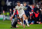 28 January 2022; Billy Burns of Ulster evades the tackle of Tyler Morgan of Scarlets during the United Rugby Championship match between Ulster and Scarlets at the Kingspan Stadium in Belfast. Photo by Ramsey Cardy/Sportsfile