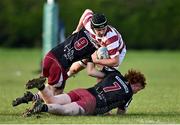 29 January 2022; Ben Butler of Tullow is tackled by Ross Houlihan, 9, and Killian McHugh of Portarlington during the Bank of Ireland Leinster Rugby Under-18 Tom D’Arcy Cup First Round match between Portarlington RFC and Tullow RFC, Carlow at Portarlington RFC in Portarlington, Laois. Photo by Sam Barnes/Sportsfile