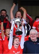 29 January 2022; Kilkerrin-Clonberne captain Louise Ward lifts the Dolores Tyrrell Memorial Cup after her side's victory in the 2021 currentaccount.ie All-Ireland Ladies Senior Club Football Championship Final match between Mourneabbey and Kilkerrin-Clonberne at St Brendan's Park in Birr, Offaly. Photo by Piaras Ó Mídheach/Sportsfile