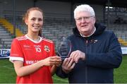 29 January 2022; Olivia Divilly of Kilkerrin-Clonberne is presented with her player of the match award by Joshua Fletcher, chief operating officer of currentaccount.ie, after the the 2021 currentaccount.ie All-Ireland Ladies Senior Club Football Championship Final match between Mourneabbey and Kilkerrin-Clonberne at St Brendan's Park in Birr, Offaly. Photo by Piaras Ó Mídheach/Sportsfile