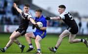 29 January 2022; Eoin McGreevey of St Finbarr's in action against Ceilum Docherty, left, and Miceal Rooney of Kilcoo during the AIB GAA Football All-Ireland Senior Club Championship Semi-Final match between St Finbarr's, Cork, and Kilcoo, Down, at MW Hire O'Moore Park in Portlaoise, Laois. Photo by Brendan Moran/Sportsfile
