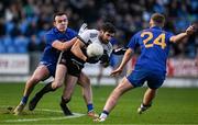 29 January 2022; Niall Branagan of Kilcoo in action against Conor McCrickard, left, and Eoin McGreevey of St Finbarr's during the AIB GAA Football All-Ireland Senior Club Championship Semi-Final match between St Finbarr's, Cork, and Kilcoo, Down, at MW Hire O'Moore Park in Portlaoise, Laois. Photo by Brendan Moran/Sportsfile