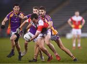 29 January 2022; Hubert Darcy of Pádraig Pearse's is tackled by Kilmacud Crokes players, from right, Andrew McGowan, Ross McGowan and Rory O'Carroll during the AIB GAA Football All-Ireland Senior Club Championship Semi-Final match between Pádraig Pearses, Roscommon, and Kilmacud Crokes, Dublin, at Kingspan Breffni in Cavan. Photo by David Fitzgerald/Sportsfile