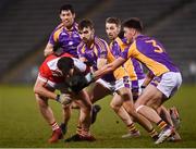 29 January 2022; Hubert Darcy of Pádraig Pearse's is tackled by Andrew McGowan, right, and Ben Shovlin of Kilmacud Crokes during the AIB GAA Football All-Ireland Senior Club Championship Semi-Final match between Pádraig Pearses, Roscommon, and Kilmacud Crokes, Dublin, at Kingspan Breffni in Cavan. Photo by David Fitzgerald/Sportsfile