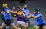 29 January 2022; Connal Flood of Wexford in action against Daire Gray of Dublin, left, and James Madden during the Walsh Cup Final match between Dublin and Wexford at Croke Park in Dublin. Photo by Ray McManus/Sportsfile