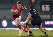 29 January 2022; Jack Crowley of Munster takes on Enrico Lucchin of Zebre during the United Rugby Championship match between Zebre Parma and Munster at Stadio Sergio Lanfranchi in Parma, Italy. Photo by Roberto Bregani/Sportsfile