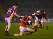 29 January 2022; Anthony Butler of Pádraig Pearse's in action against Dara Mullen, left, and Shane Horan of Kilmacud Crokes during the AIB GAA Football All-Ireland Senior Club Championship Semi-Final match between Pádraig Pearses, Roscommon, and Kilmacud Crokes, Dublin, at Kingspan Breffni in Cavan. Photo by David Fitzgerald/Sportsfile