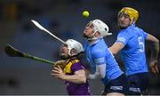 29 January 2022; Oisín Foley of Wexford in action against Andrew Dunphy and Daire Gray, right, of Dublin during the Walsh Cup Final match between Dublin and Wexford at Croke Park in Dublin. Photo by Stephen McCarthy/Sportsfile