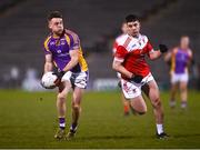 29 January 2022; Cian O'Connor of Kilmacud Crokes in action against Conor Daly of Pádraig Pearse's during the AIB GAA Football All-Ireland Senior Club Championship Semi-Final match between Pádraig Pearses, Roscommon, and Kilmacud Crokes, Dublin, at Kingspan Breffni in Cavan. Photo by David Fitzgerald/Sportsfile