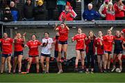 29 January 2022; Michelle Dunleavy of Kilkerrin-Clonberne jumps in celebration as she and her fellow substitutes look on during the closing seconds of the 2021 currentaccount.ie All-Ireland Ladies Senior Club Football Championship Final match between Mourneabbey and Kilkerrin-Clonberne at St Brendan's Park in Birr, Offaly. Photo by Piaras Ó Mídheach/Sportsfile