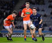 29 January 2022; Dublin goalkeeper Evan Comerford prepares to clear under pressure from Armagh players Jason Duffy , left, and Rian O'Neill during the Allianz Football League Division 1 match between Dublin and Armagh at Croke Park in Dublin. Photo by Ray McManus/Sportsfile