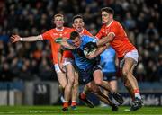 29 January 2022; Ciarán Kilkenny of Dublin is tackled by Rory Grugan, left, and Niall Grimley of Armagh during the Allianz Football League Division 1 match between Dublin and Armagh at Croke Park in Dublin. Photo by Ray McManus/Sportsfile