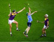 29 January 2022; Fergal Whitely of Dublin in action against Jack O'Connor, left, and Conor Devitt of Wexford during the Walsh Cup Final match between Dublin and Wexford at Croke Park in Dublin. Photo by Stephen McCarthy/Sportsfile