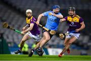 29 January 2022; Conor Burke of Dublin in action against David Dunne, left, and Mikie Dwyer of Wexford during the Walsh Cup Final match between Dublin and Wexford at Croke Park in Dublin. Photo by Stephen McCarthy/Sportsfile
