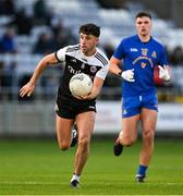 29 January 2022; Dylan Ward of Kilcoo in action against Brian Hayes of St Finbarr's during the AIB GAA Football All-Ireland Senior Club Championship Semi-Final match between St Finbarr's, Cork, and Kilcoo, Down, at MW Hire O'Moore Park in Portlaoise, Laois. Photo by Brendan Moran/Sportsfile