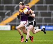 30 January 2022; Tom Byrne of Wexford in action against Peter Laffey of Sligo during the Allianz Football League Division 4 match between Wexford and Sligo at Chadwicks Wexford Park in Wexford. Photo by Matt Browne/Sportsfile