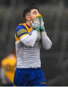 30 January 2022; Cathal Heneghan of Roscommon dries his face with his jersey before the Allianz Football League Division 2 match between Roscommon and Cork at Dr Hyde Park in Roscommon. Photo by David Fitzgerald/Sportsfile
