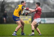 30 January 2022; Enda Smith of Roscommon in action against Sean Powter of Cork during the Allianz Football League Division 2 match between Roscommon and Cork at Dr Hyde Park in Roscommon. Photo by David Fitzgerald/Sportsfile