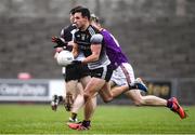 30 January 2022; Niall Murphy of Sligo in action against Tom Byrne of Wexford during the Allianz Football League Division 4 match between Wexford and Sligo at Chadwicks Wexford Park in Wexford. Photo by Matt Browne/Sportsfile