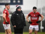30 January 2022; Cork manager Keith Ricken with Cian Kiely, left, and Mark Cronin at half time during the Allianz Football League Division 2 match between Roscommon and Cork at Dr Hyde Park in Roscommon. Photo by David Fitzgerald/Sportsfile