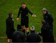 30 January 2022; Referee Seamus Mulhare, centre, speaks with sideline officials and Roscommon manager Anthony Cunningham over a substitute during the Allianz Football League Division 2 match between Roscommon and Cork at Dr Hyde Park in Roscommon. Photo by David Fitzgerald/Sportsfile