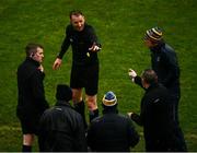 30 January 2022; Referee Seamus Mulhare, centre, speaks with sideline officials and Roscommon manager Anthony Cunningham over a substitute during the Allianz Football League Division 2 match between Roscommon and Cork at Dr Hyde Park in Roscommon. Photo by David Fitzgerald/Sportsfile