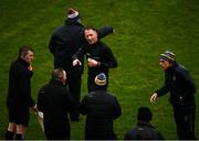 30 January 2022; Referee Seamus Mulhare, centre, speaks with sideline officials and Roscommon manager Anthony Cunningham over a substitute during the Allianz Football League Division 2 match between Roscommon and Cork at Dr Hyde Park in Roscommon. Photo by David Fitzgerald/Sportsfile