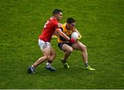 30 January 2022; Richard Hughes of Roscommon in action against Sean Powter of Cork during the Allianz Football League Division 2 match between Roscommon and Cork at Dr Hyde Park in Roscommon. Photo by David Fitzgerald/Sportsfile