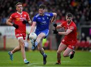 30 January 2022; Andrew Woods of Monaghan in action against Conn Kilpatrick, left, and Richard Donnelly of Tyrone during the Allianz Football League Division 1 match between Tyrone and Monaghan at O'Neill's Healy Park in Omagh, Tyrone. Photo by Brendan Moran/Sportsfile