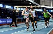 30 January 2022; Athletes from Craughwell AC, Galway, pass the baton whilst competing in the Master's Men 4x200m relay during the Irish Life Health National Masters Indoor Championships at TUS International Arena in Athlone, Westmeath. Photo by Sam Barnes/Sportsfile