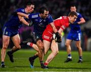 30 January 2022; Peter Harte of Tyrone is tackled by Shane Carey and Jack McCarron of Monaghan during the Allianz Football League Division 1 match between Tyrone and Monaghan at O'Neill's Healy Park in Omagh, Tyrone. Photo by Brendan Moran/Sportsfile
