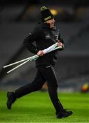 29 January 2022; Stuart Wilson, Pitch Manager Croke Park Stadium & GAA National Games Development Centre, brings a green and white flag to the umpires before the Walsh Cup Final match between Dublin and Wexford at Croke Park in Dublin. Photo by Ray McManus/Sportsfile