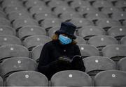 29 January 2022; A Dublin supporter reads her programme before the Walsh Cup Final match between Dublin and Wexford at Croke Park in Dublin. Photo by Ray McManus/Sportsfile