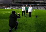 29 January 2022; Robert Smith, production manager and event director, Robert Smith Events, takes a photo of the match referee Patrick Murphy, his dad Paddy, right, and his son Colin, left, who acted as two of his four umpires for the Walsh Cup Final match between Dublin and Wexford at Croke Park in Dublin. Photo by Ray McManus/Sportsfile