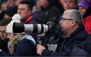 29 January 2022; A supporter, in the Hogan Stand, awaiits the action to photograph during the Walsh Cup Final match between Dublin and Wexford at Croke Park in Dublin. Photo by Ray McManus/Sportsfile