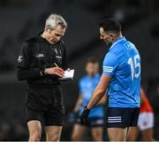 29 January 2022; Referee Fergal Kelly notes the name of Ryan Basquel of Dublin before issuing him a yellow card during the Allianz Football League Division 1 match between Dublin and Armagh at Croke Park in Dublin. Photo by Ray McManus/Sportsfile