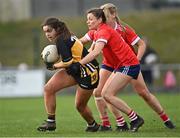 29 January 2022; Laura Fitzgerald of Mourneabbey is tackled by Kilkerrin-Clonberne players Aisling Costello, centre, and Sarah Gormally during the 2021 currentaccount.ie All-Ireland Ladies Senior Club Football Championship Final match between Mourneabbey and Kilkerrin-Clonberne at St Brendan's Park in Birr, Offaly. Photo by Piaras Ó Mídheach/Sportsfile