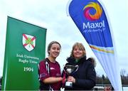 2 February 2022; NUI Galway captain Elli Mae Maguire is presented with the runners-up cup by Kay Bowen after the final of the Maxol Kay Bowen Cup between UCD and NUI Galway at Barnhall RFC in Leixlip, Kildare, which saw UCD victorious in an exciting  50 – 0 win. Photo by Brendan Moran/Sportsfile