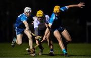 3 February 2022; Mark Rogers of University of Limerick in action against Finn Murphy, left, and Darragh Eggerton of TU Dublin during the Electric Ireland HE GAA Fitzgibbon Cup Round 3 match between TU Dublin and University of Limerick at TU Dublin Grangegorman in Dublin. Photo by Ben McShane/Sportsfile