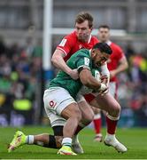 5 February 2022; Bundee Aki of Ireland is tackled by Nick Tompkins of Wales during the Guinness Six Nations Rugby Championship match between Ireland and Wales at the Aviva Stadium in Dublin. Photo by Brendan Moran/Sportsfile